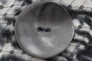 raffinierter Knopf Metall